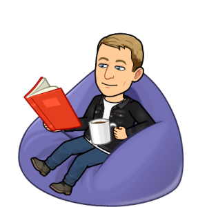 chilling and reading a book with a mug on a bean bag chair