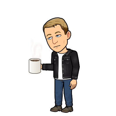 looking sleepy holding a cup of coffee