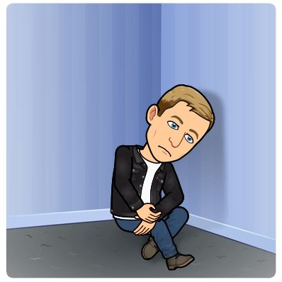 looking sad and depressed while huddling in a corner staring blankly at the ground