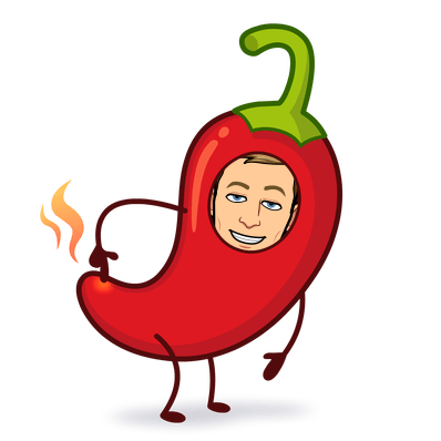 smiling mischievously in a red chili pepper costume and pointing at the flaming tip
