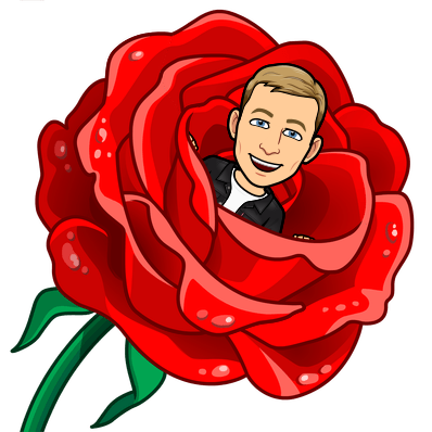 popping out from the centre of a red rose looking happy