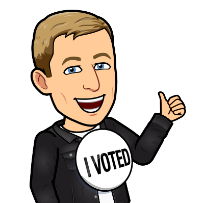 smiling giving a thumbs up wearing a button, i voted