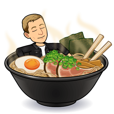 chilling in a bowl of steaming ramen topped with eggs and seaweed looking relaxed