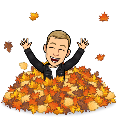 popping out from a pile of leaves and having a good time with arms raised 