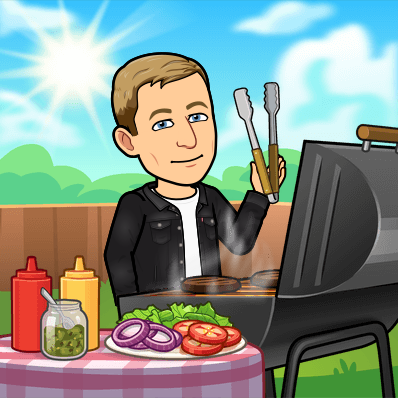 smiling and masterfully grilling burgers for a summer bbq