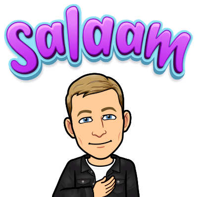 smiling and with hand on heart, salaam