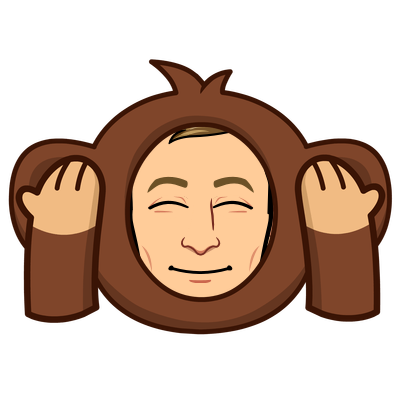 in a monkey costume smiling with eyes closed and covering ears