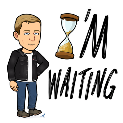 looking unimpressed while tapping foot next to large hour glass, I'm waiting