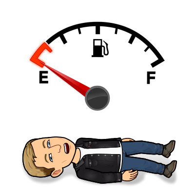 looking done while laying on the ground below an empty gas tank image