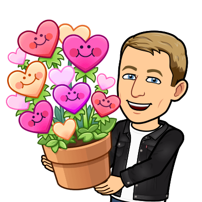 smiling and holding a pot of heart flower with smiling faces