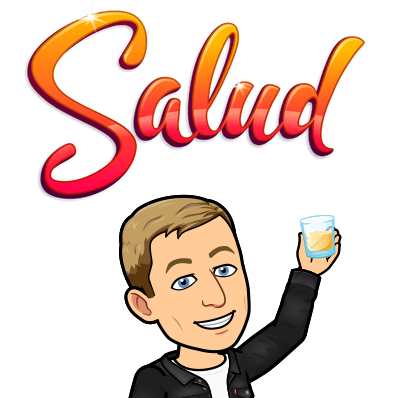 smiling and holding up a drinking glass, salud