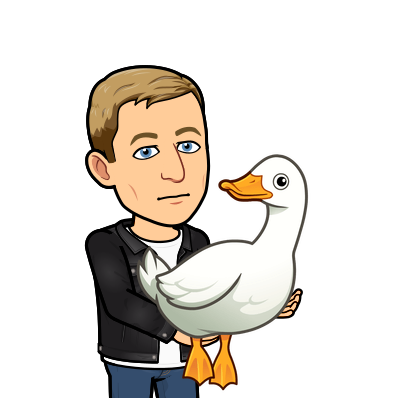 holding a duck with a blank expression