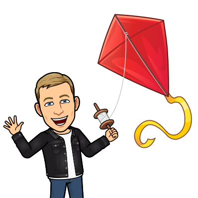 cheerfully waving while flying a kite