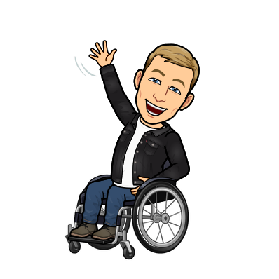 sitting in wheelchair waving enthusiastically