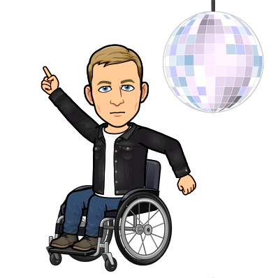 disco dancing in wheelchair next to a sparkling disco ball