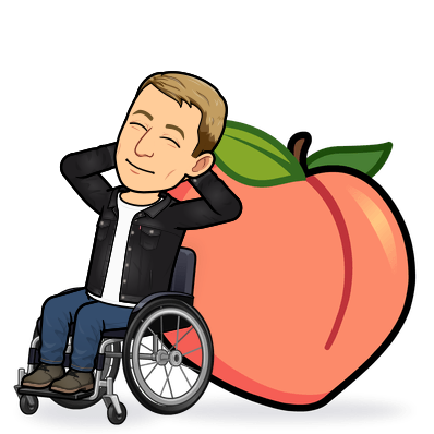 smiling in a wheelchair learning on a giant peach emoji