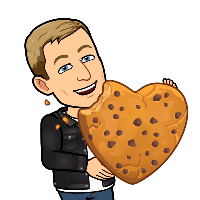 joyfully munching on a giant cookie