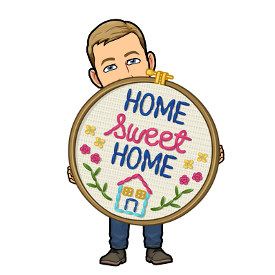 cheerfully holding a giant embroidery, home sweet home