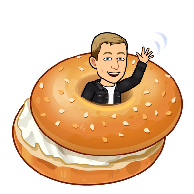 cheerfully popping out of the center of a cream cheese bagel waving