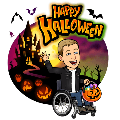 smiling and waving in a wheelchair holding a bucket of candy, happy halloween