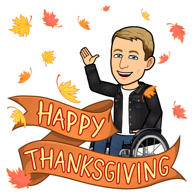 smiling and waving in a wheelchair among falling leaves, happy thanksgiving