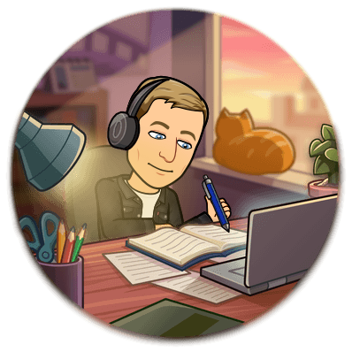 writing in a book at a desk wearing headphones surrounded by papers computer and a cat