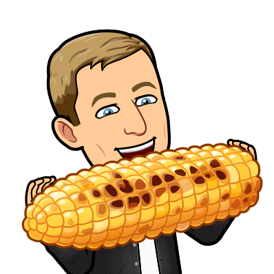 happily eating a giant barbecued piece of corn